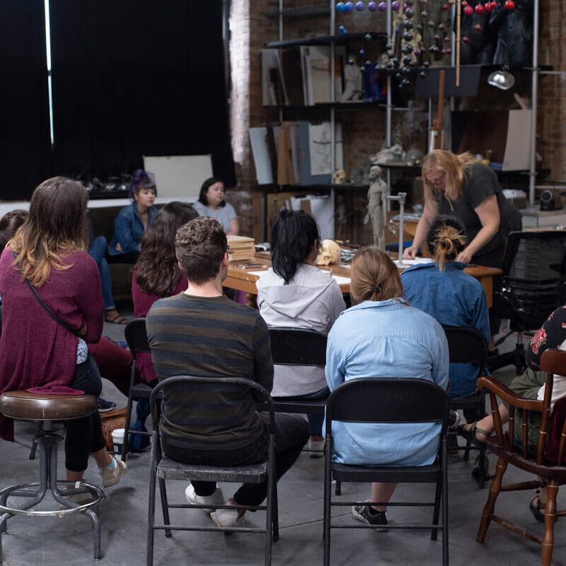 Vitruvian instructor Melinda Whitmore working with a group of biomedical visualization students.