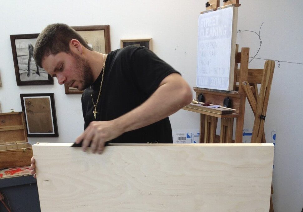 Vitruvian instructor Anthony Adcock preparing a panel for painting.